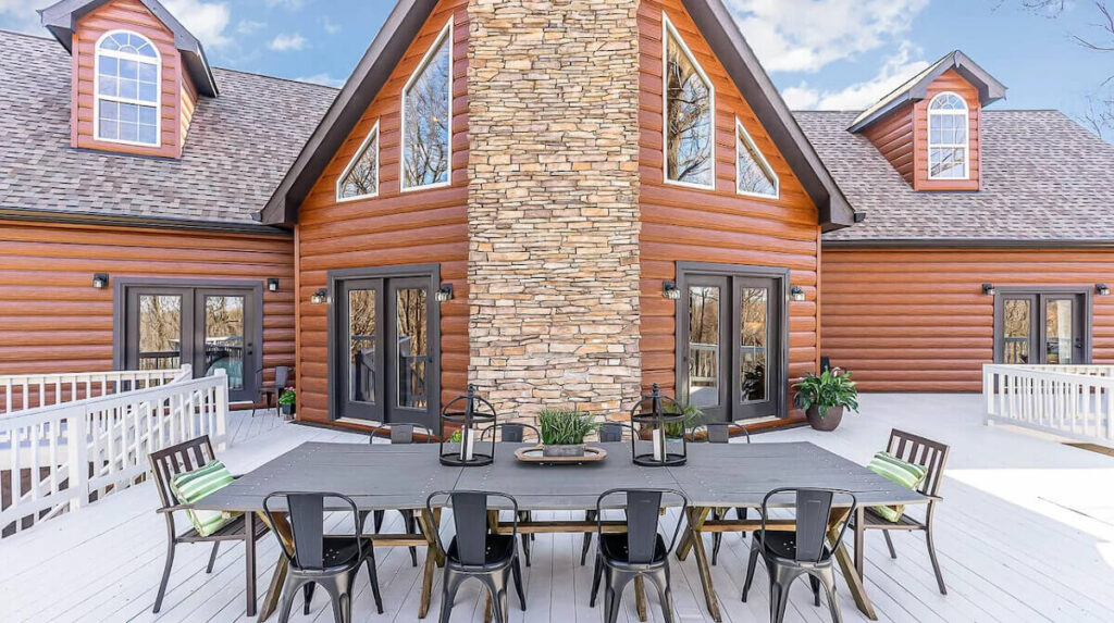 A home with a large deck and TruLog steel log siding in Western Cedar