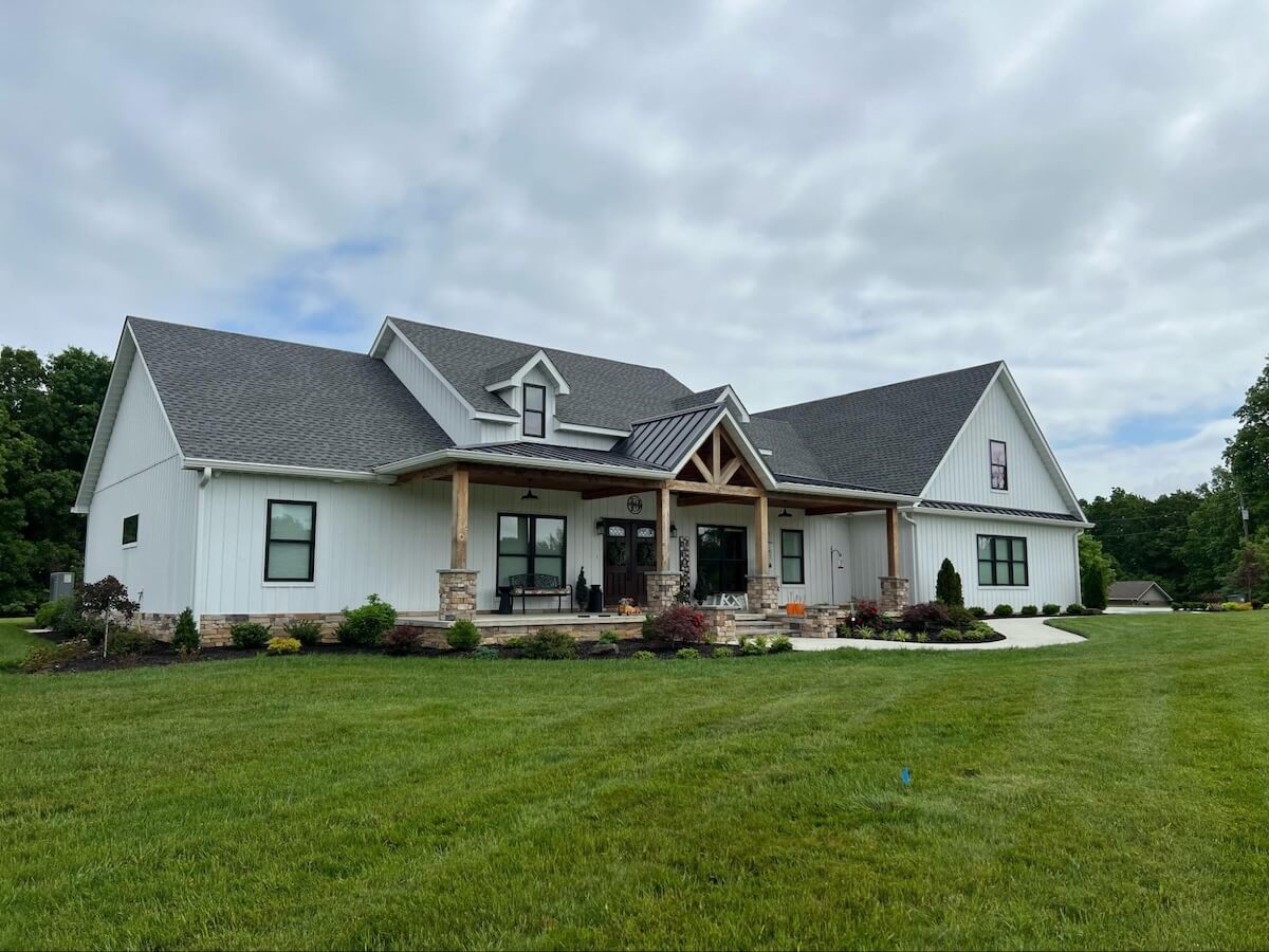 A modern farmhouse with TruLog steel board and batten siding in Matte White