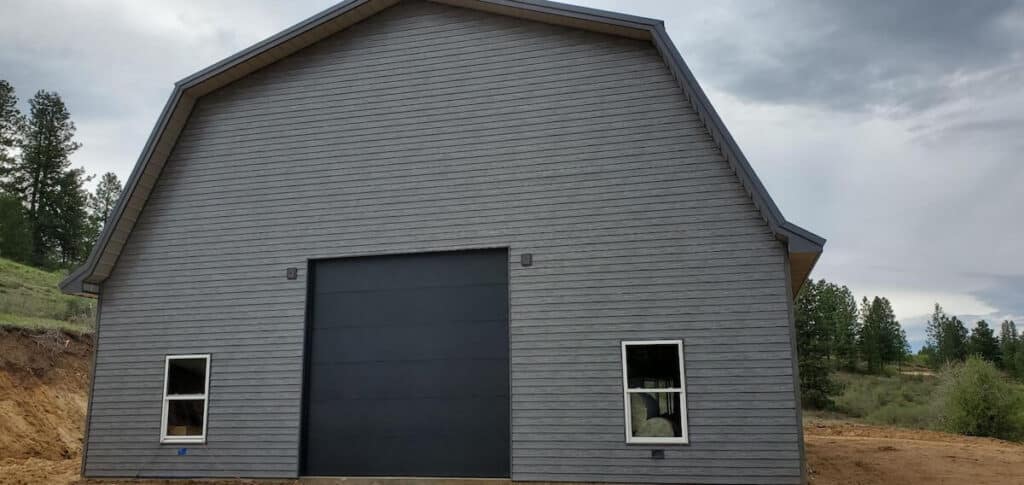 A bardominium with TruLog's woodgrain steel lap siding, a durable and modern alternative to clapboard siding