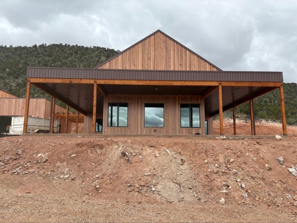 A rustic Western-style home with TruLog steel board and batten siding